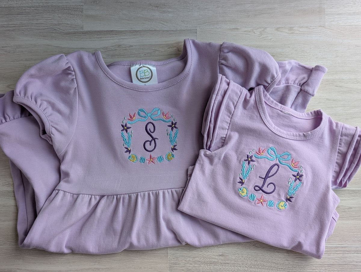 Lavender kids ruffle tee and baby onesie with embroidered under the sea monogram wreath