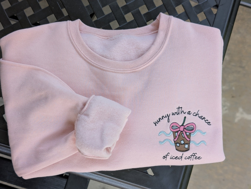 Sunny with a chance of iced coffee embroidered sweatshirt in blush pink