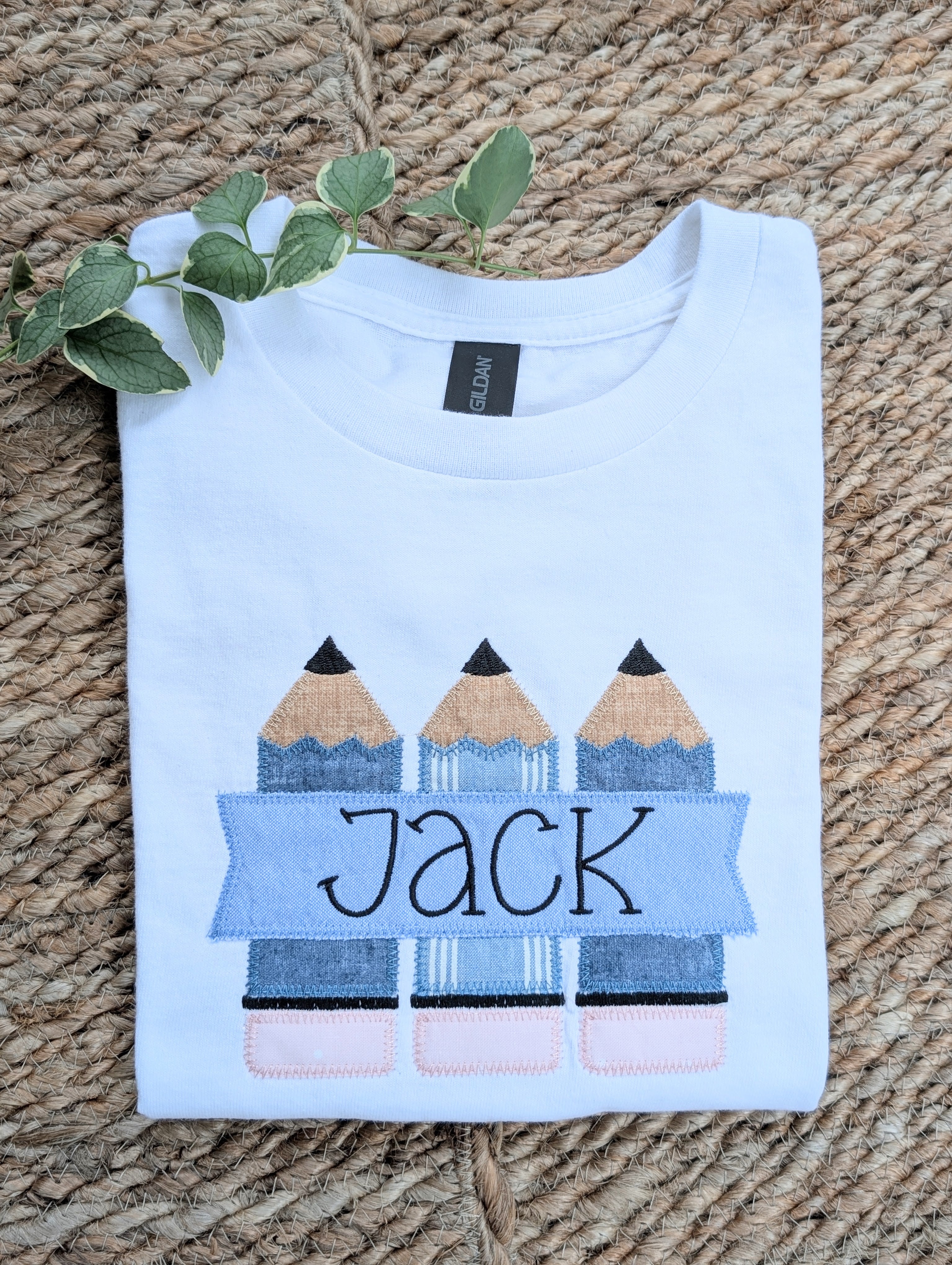 White boys Gildan tee with blue pencil applique and personalized name Jack in banner