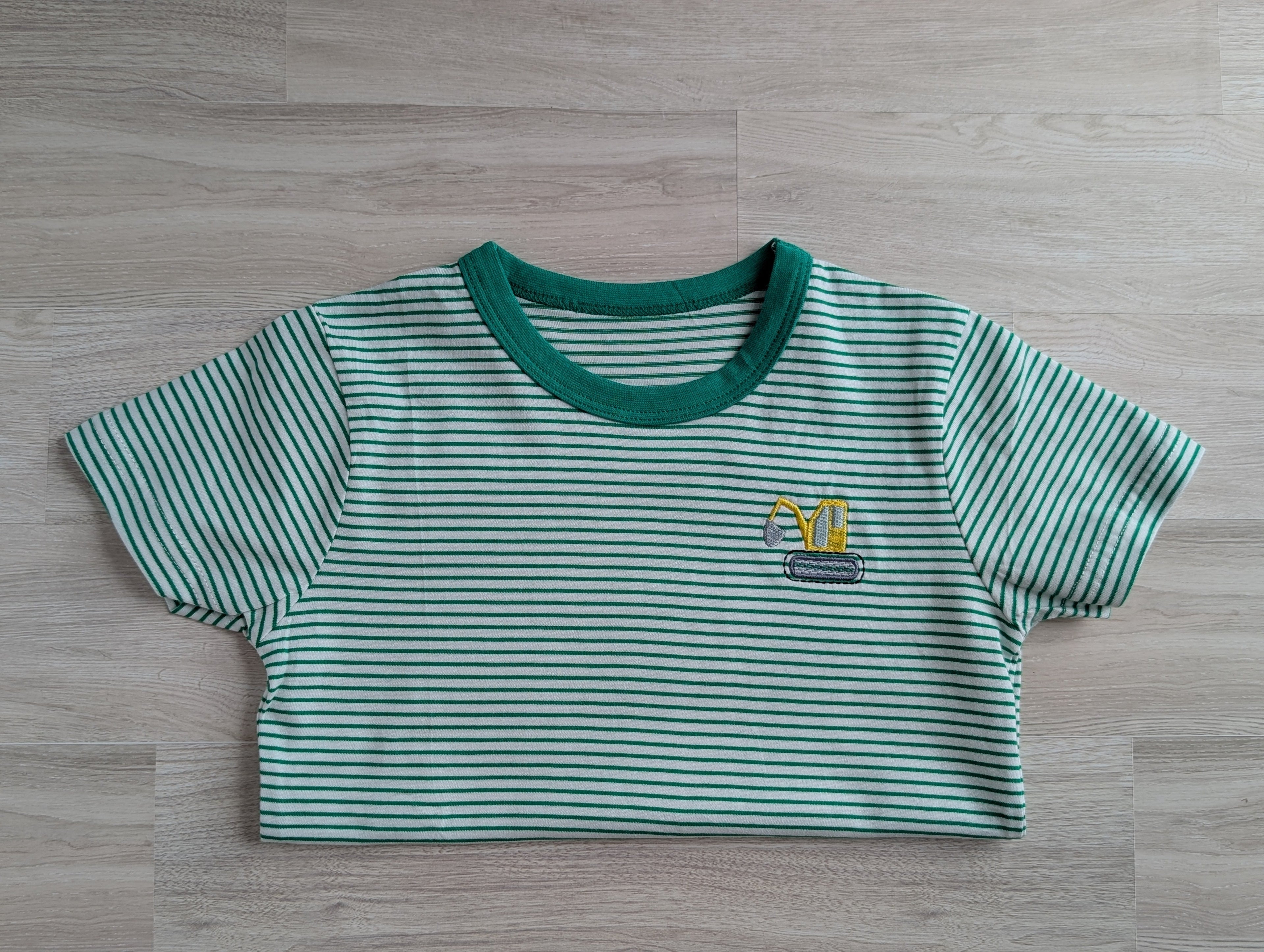 Green and white stripe boys tee with embroidered golf bag logo on chest