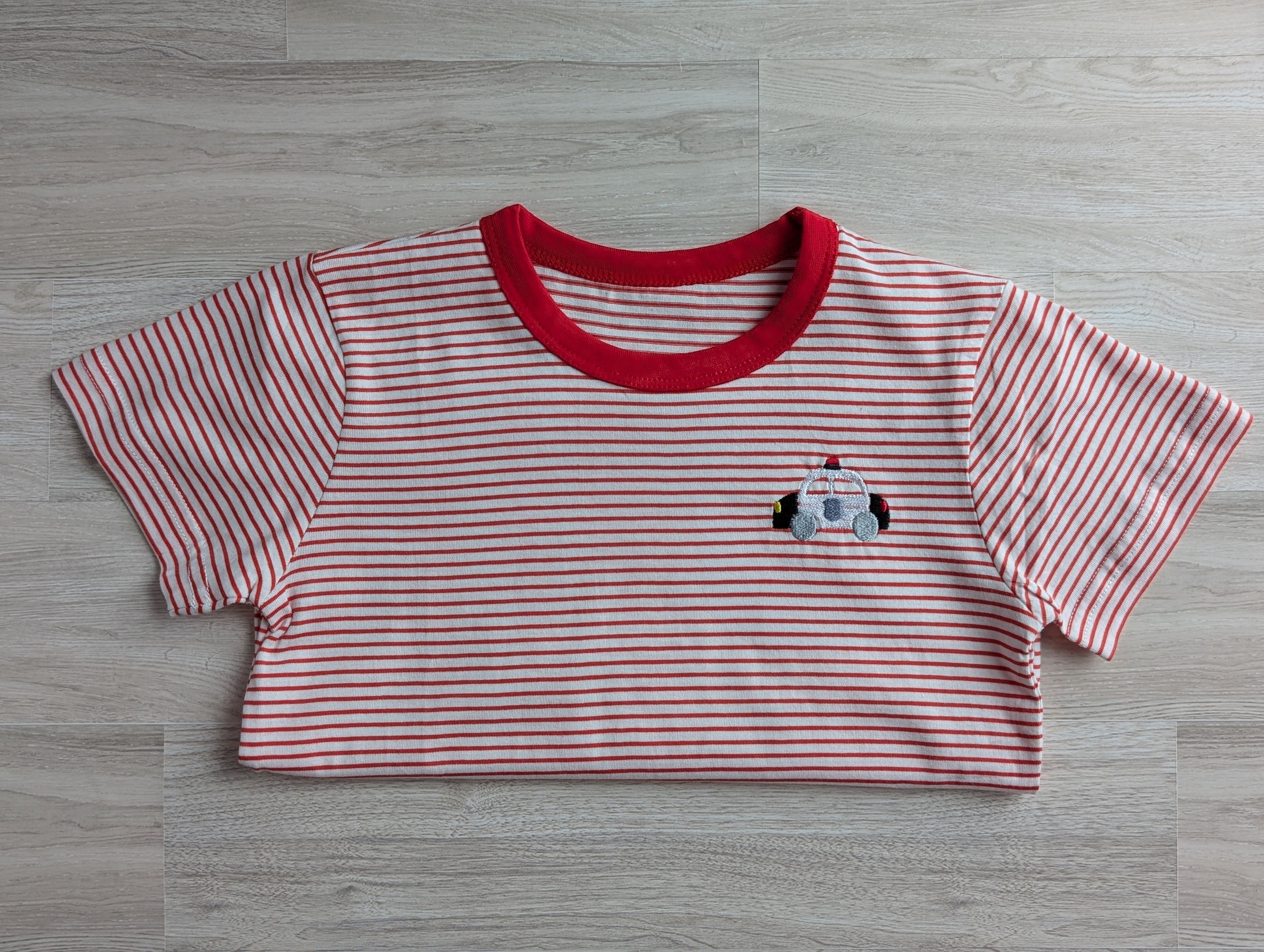 Red and white stripe boys tee with embroidered train logo on chest