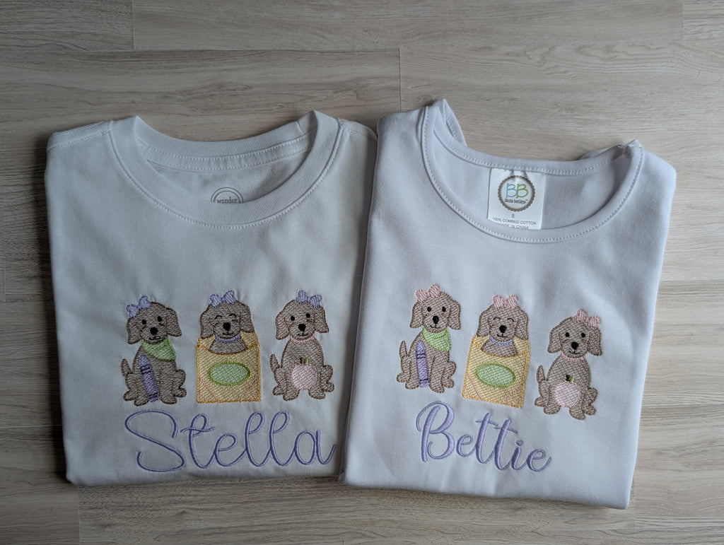 Puppy trio embroidered flutter sleeve top with name Bettie, folded flat lay