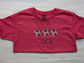 Heathered red kids tee with personalized soccer ball trio embroidery, name Jack, flat lay