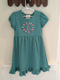 Strawberry monogram embroidered girls dress, folded flat lay