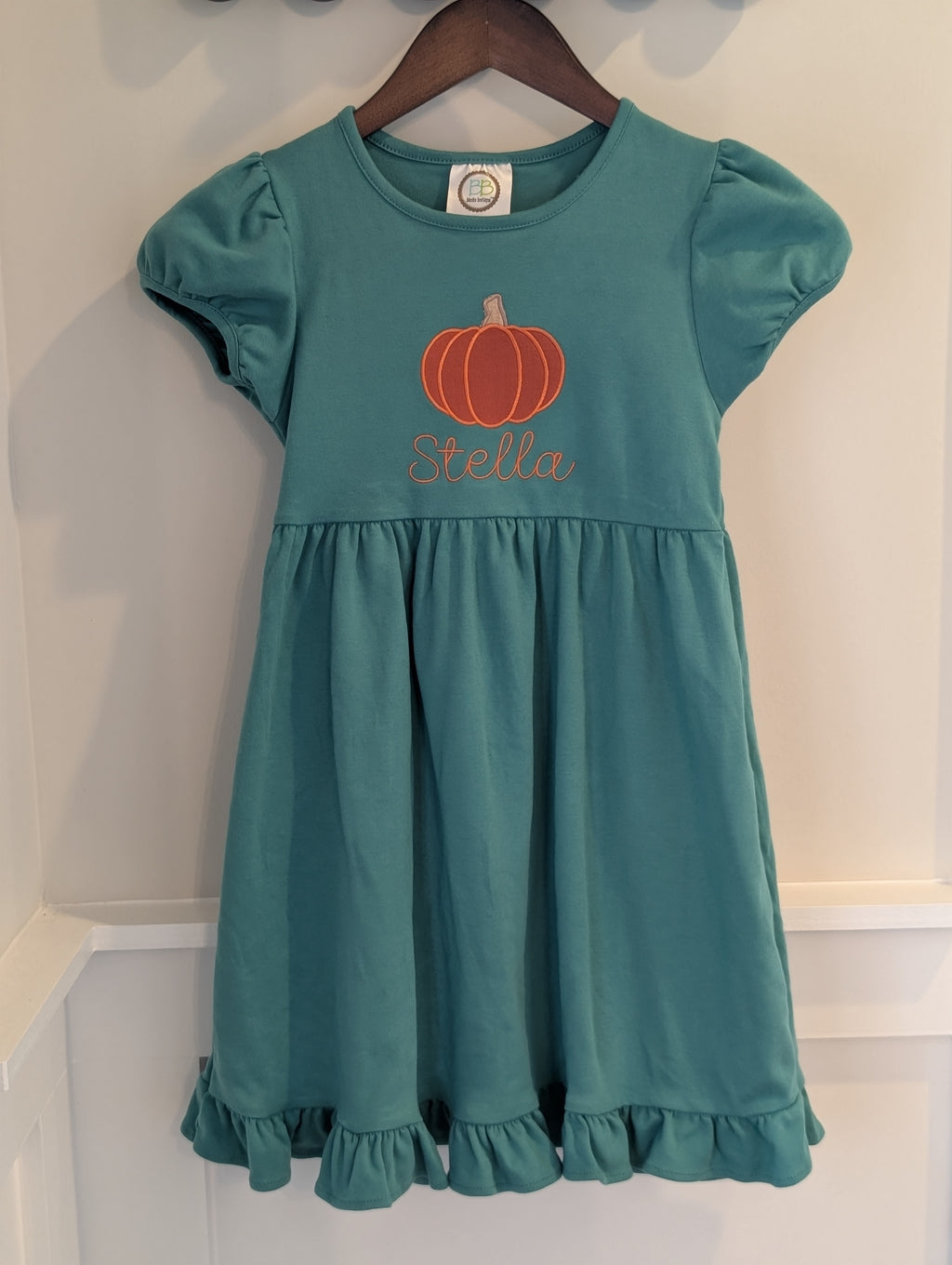 Close-up of pumpkin applique with embroidered name