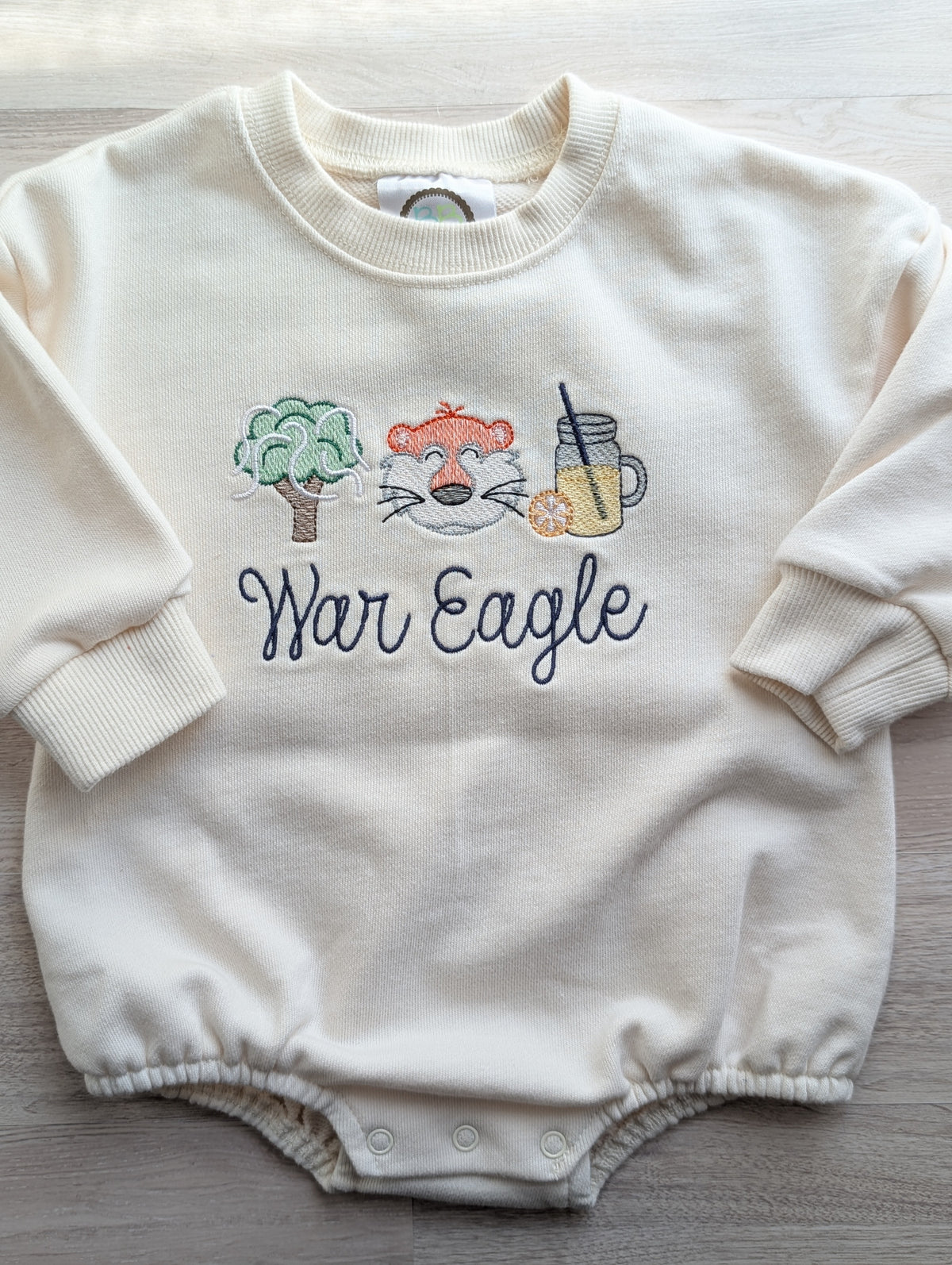 Cream oversized baby bubble sweatshirt embroidered with rolled oak tree, tiger and lemonade
