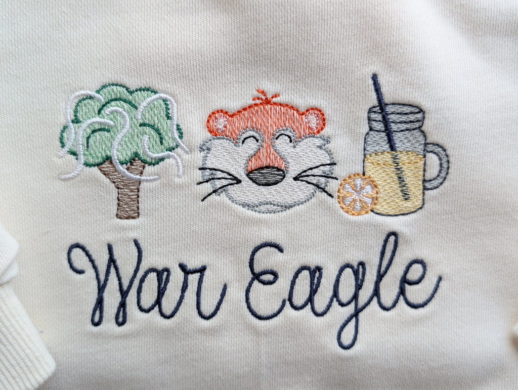 White and cream baby bubble sweatshirts showing tiger design with and without bow
