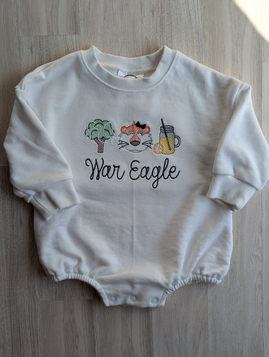 White baby bubble sweatshirt with tiger wearing a bow, oak tree and lemonade embroidery