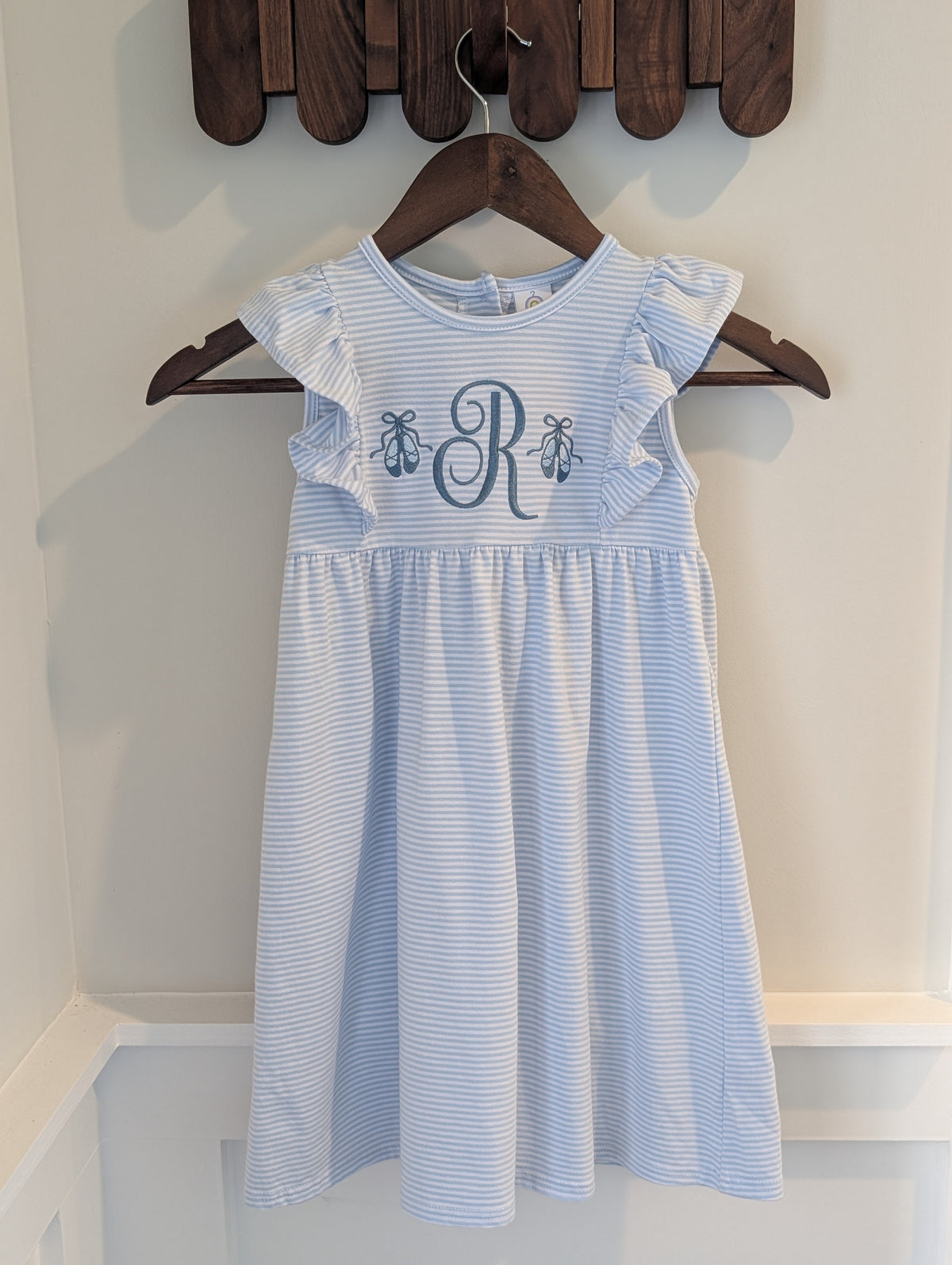 Blue striped flutter-sleeve dress with ballet slipper embroidery and sample initial R