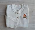 White waffle-knit long-sleeve henley with wood buttons and campfire and marshmallow design