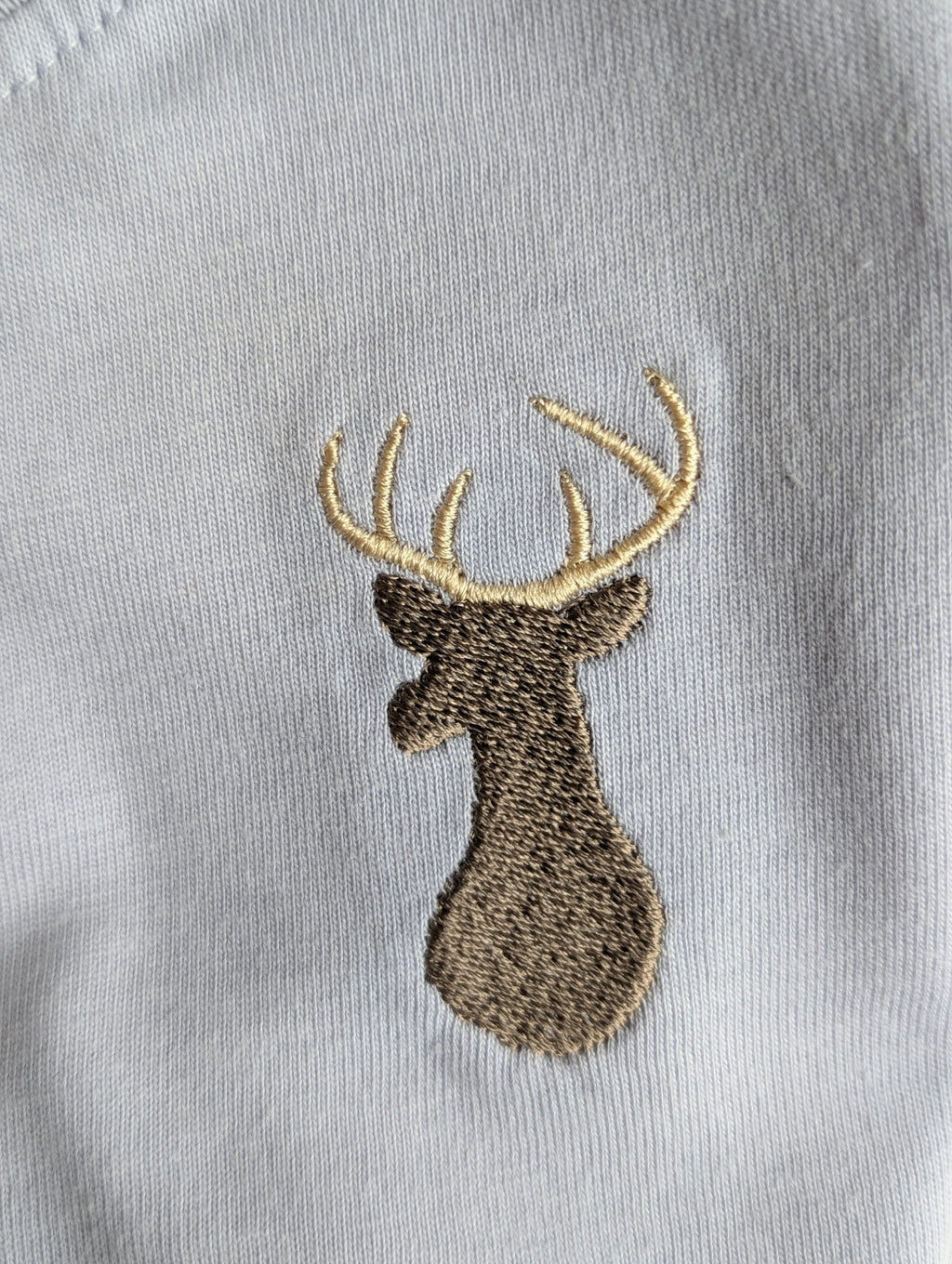 Animal motif close-up on organic cotton long-sleeve shirt