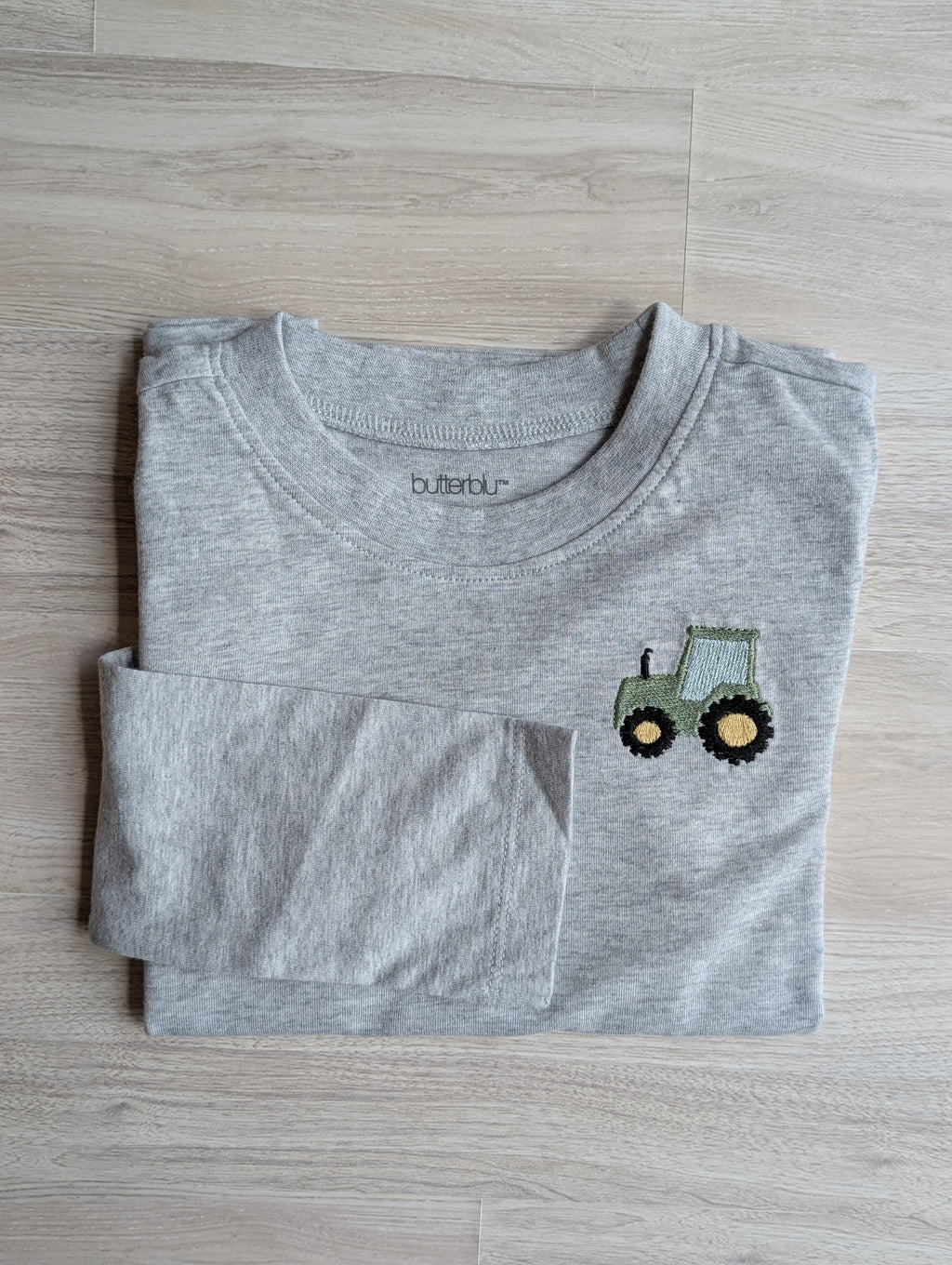 Organic cotton transportation shirt with embroidered vehicle