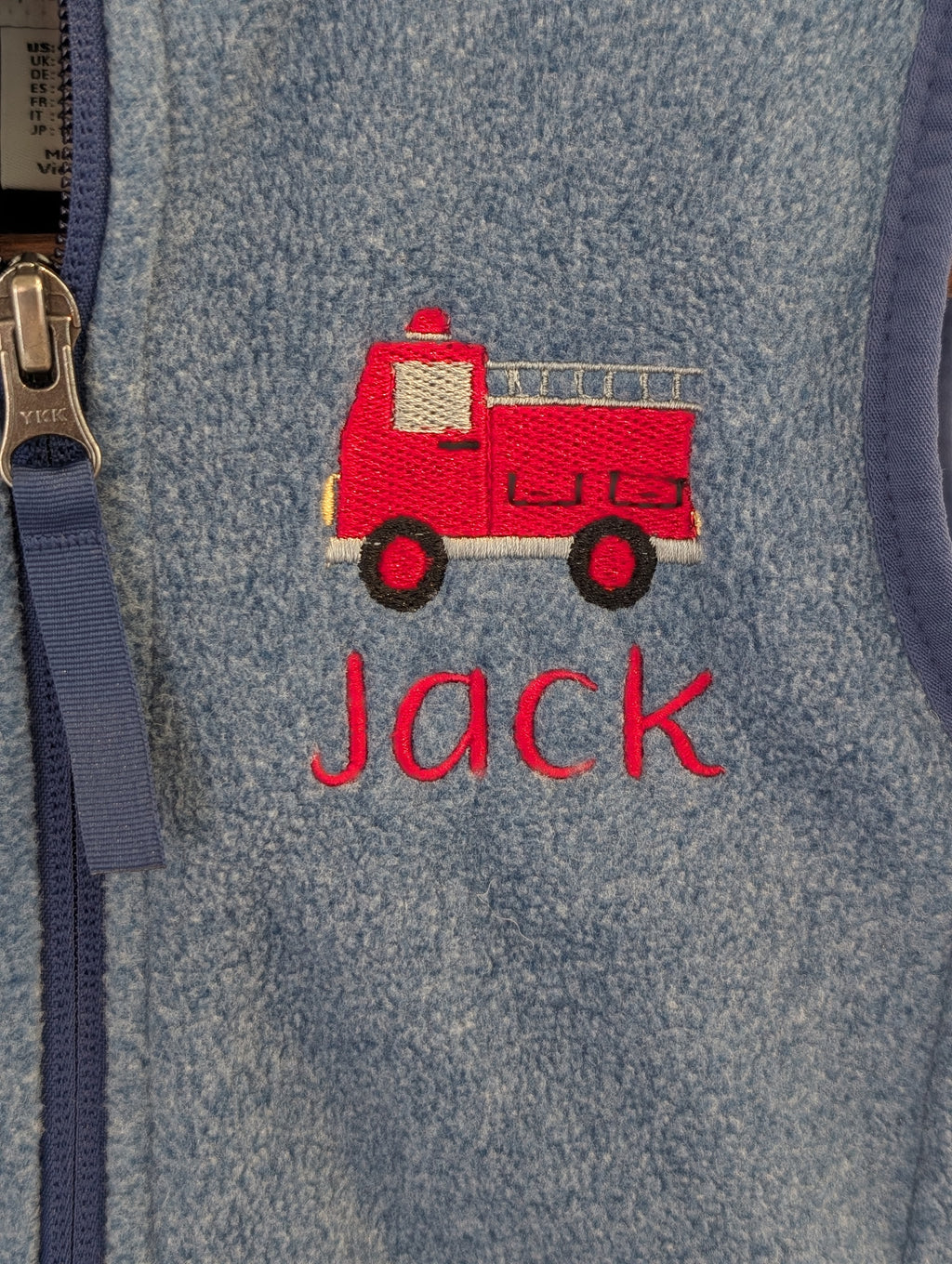 Navy polar fleece vest personalized with a fox icon and Charlie name