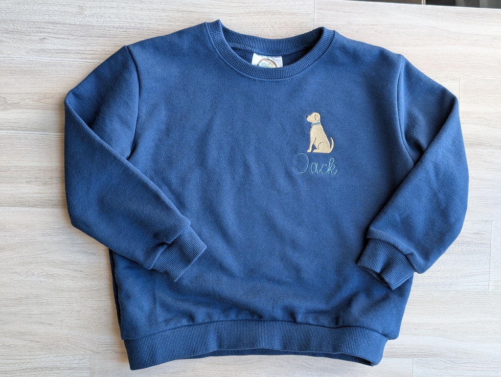 Personalized sweatshirts with dog and airplane icons showing script and print name lettering