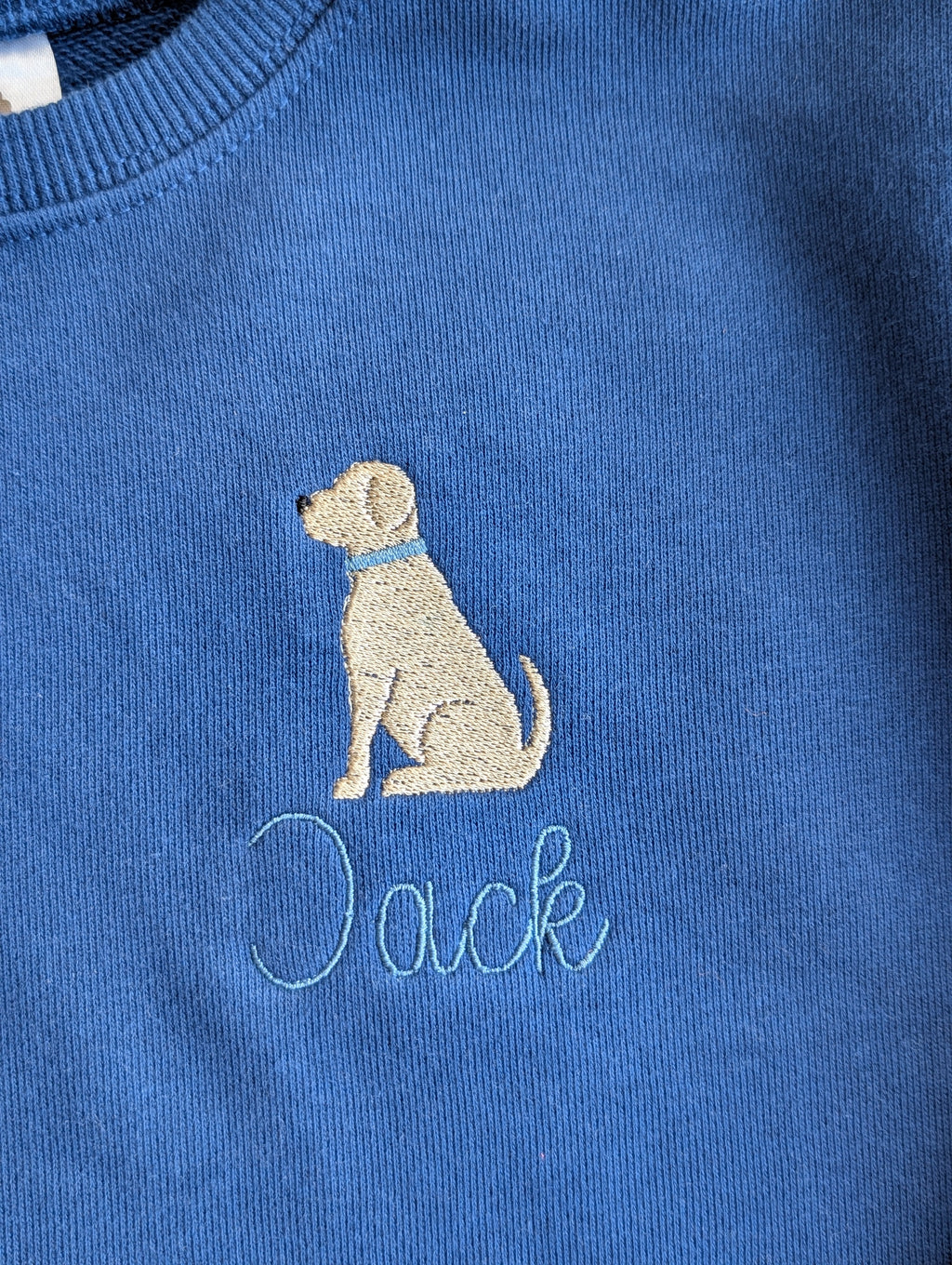 Light blue crewneck sweatshirt with airplane icon and Jack in print lettering